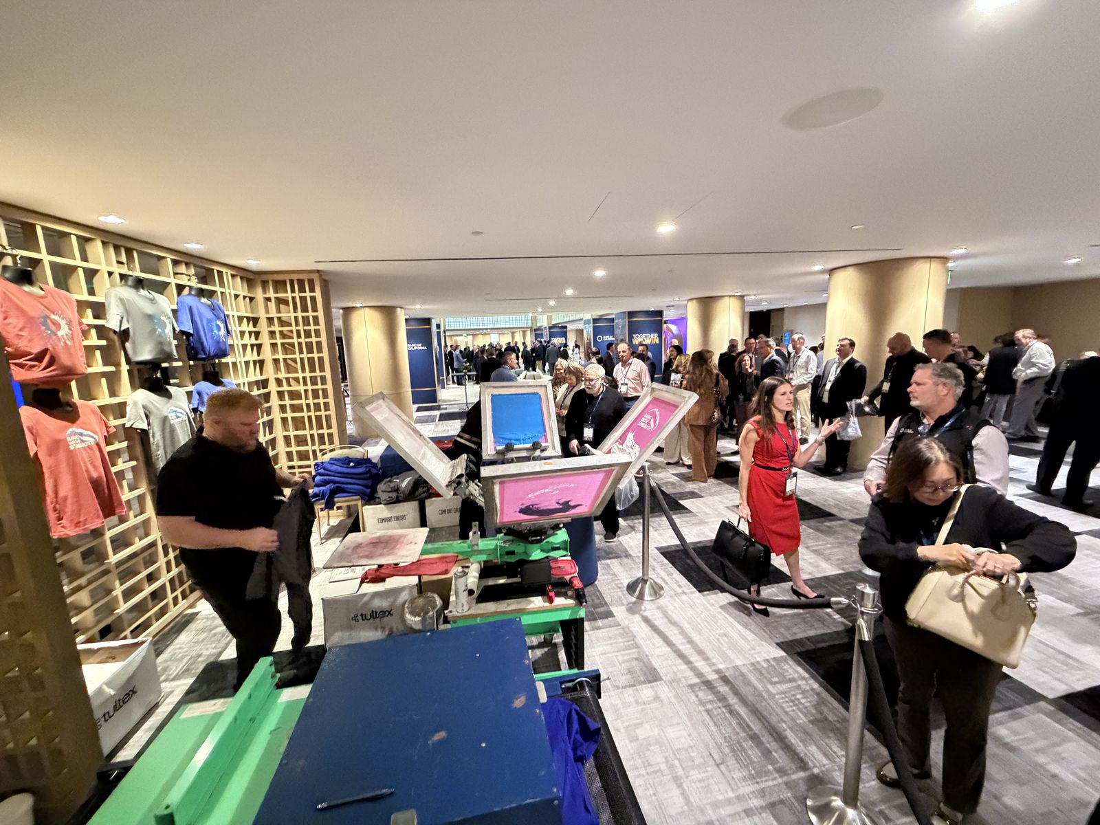 Merch Troop live screen-printing station running at a Raleigh event